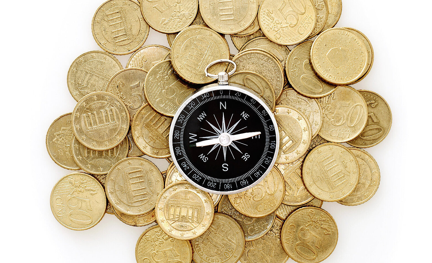 Foto Kompass liegt au Münzen